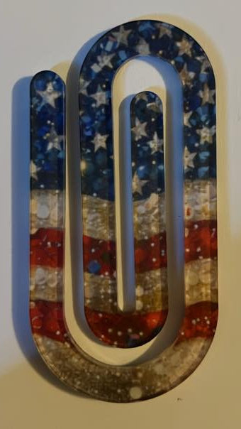 Decorative letter 'U' with American flag pattern on a plain background