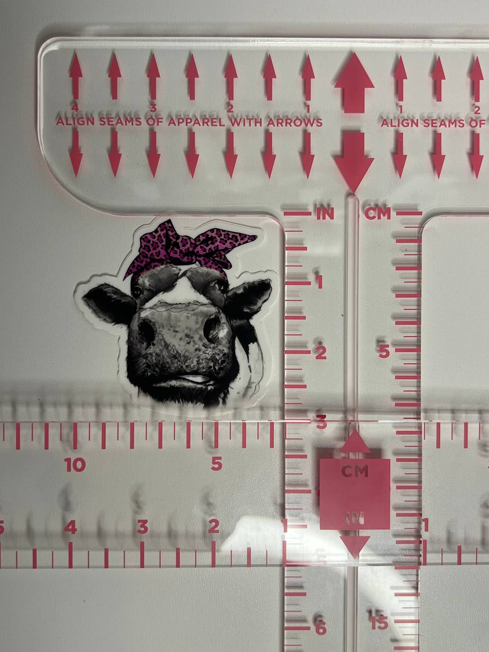 Measurement tool with a cow illustration and measurement markings