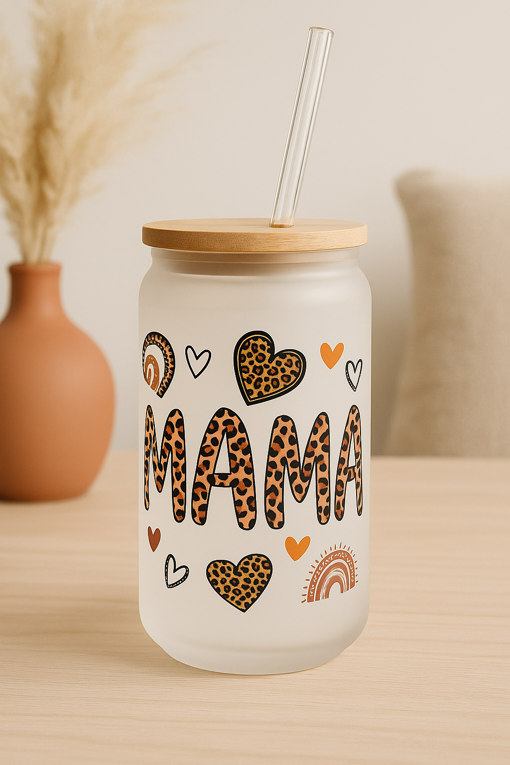 Tumbler with 'MAMA' text and heart designs on a neutral background