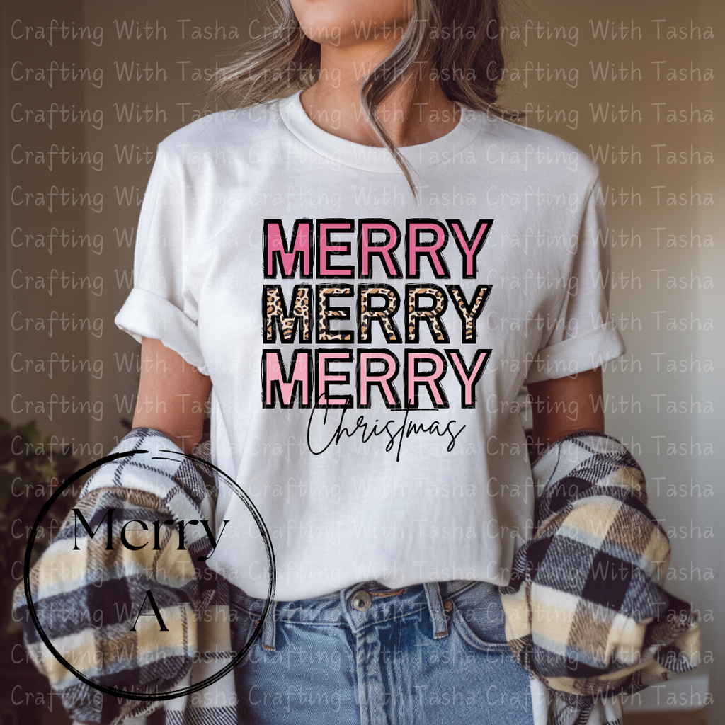 Person wearing a white t-shirt with 'MERRY MERRY MERRY Christmas' text, holding plaid gloves.